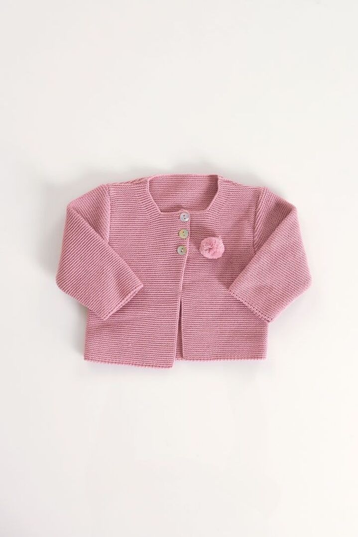 Kidbeste à pompons en tricot